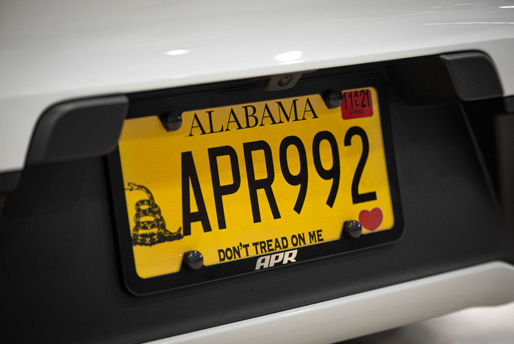 APR LICENSE PLATE FRAME - SLIM, BLACK W/ HIDERS